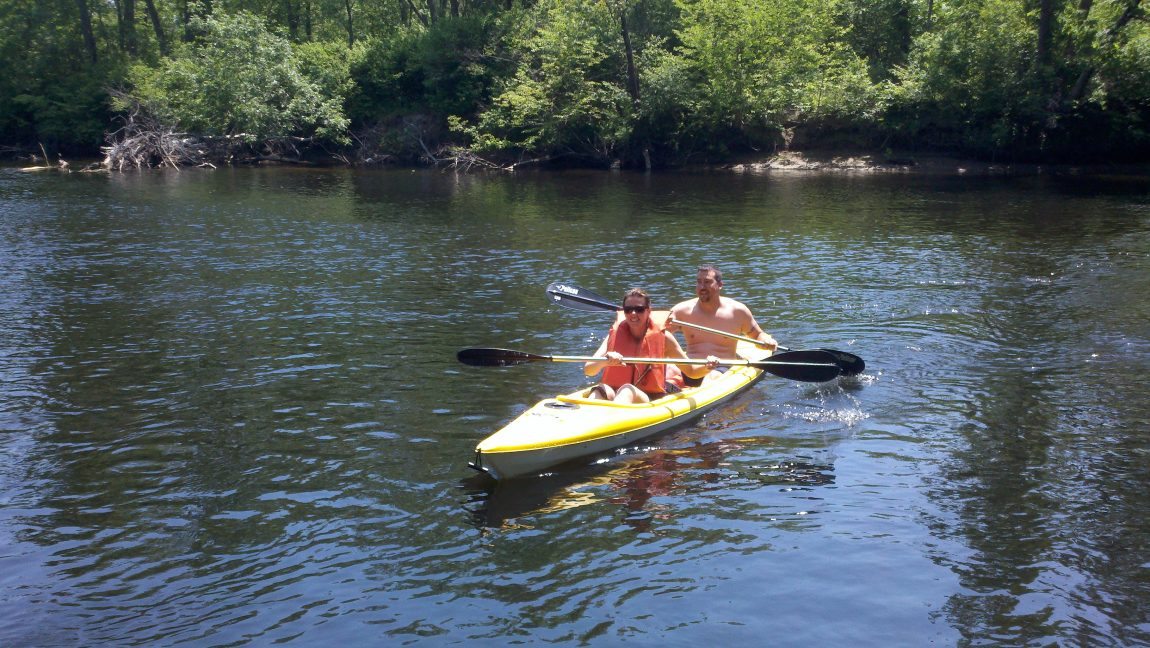 Warrensburg Travel Park Riverfront Campground in the Adirondacks Mountains near lake george 2 kayakers having fun