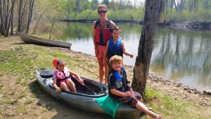 kayakers on river bank