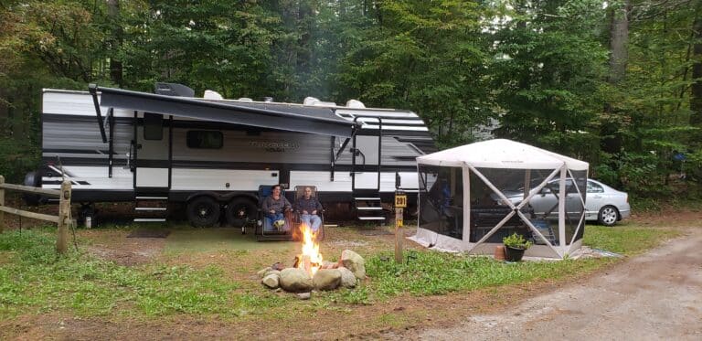 RV campsite with campfire at Warrensburg Travel Park